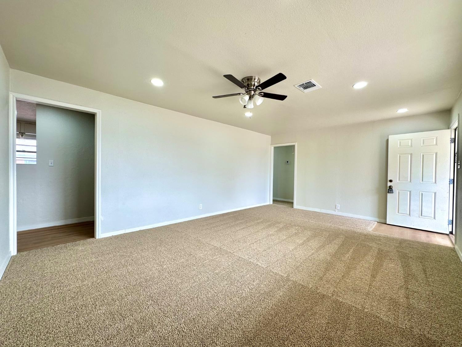 101 15th Street Levelland, TX 79336 - Photo 3 of 29 a view of an empty room with a ceiling fan
