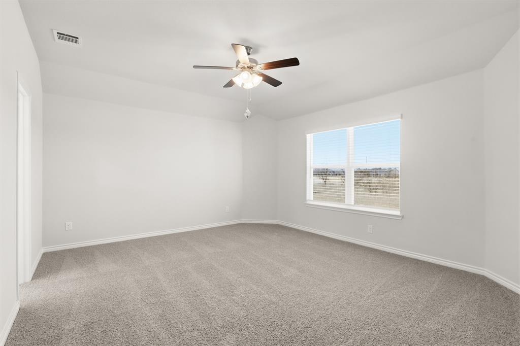 10612 Brocket Lane Crowley, TX 76036 - Photo 8 of 35 an empty room with a window and a fan