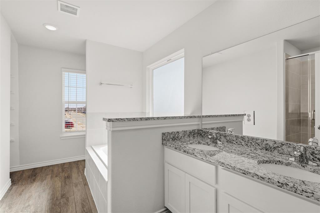 10612 Brocket Lane Crowley, TX 76036 - Photo 10 of 35 a bathroom with a granite countertop sink and a mirror
