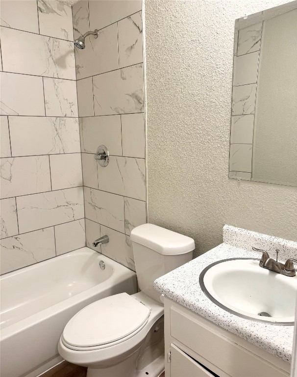 5011 Copperbend Boulevard, Unit A Austin, TX 78744 - Photo 11 of 18 a bathroom with a toilet a sink and bathtub