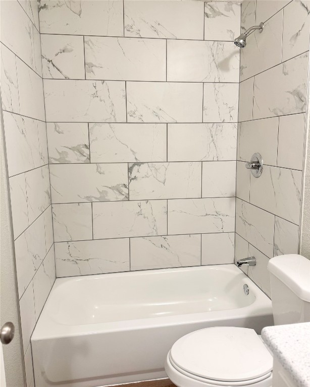 5011 Copperbend Boulevard, Unit A Austin, TX 78744 - Photo 12 of 18 a bathroom with a toilet and bathtub