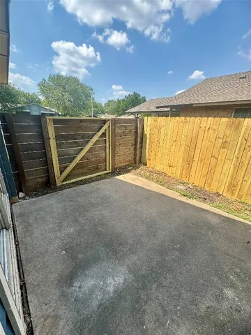 a view of a yard with a tree