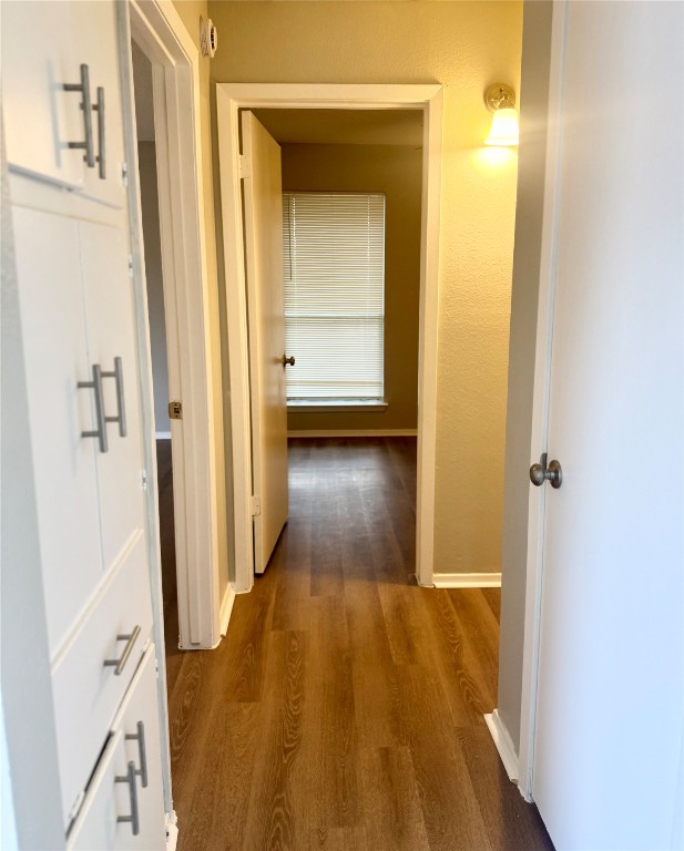 5011 Copperbend Boulevard, Unit A Austin, TX 78744 - Photo 8 of 18 a view of a hallway with wooden floor and closet