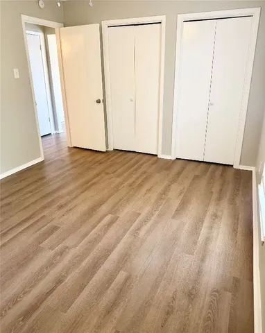 a bathroom with a toilet and bathtub