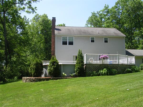 108 Fitch Road Lancaster, MA 01523 - Photo 13 of 20 a front view of a house with a garden