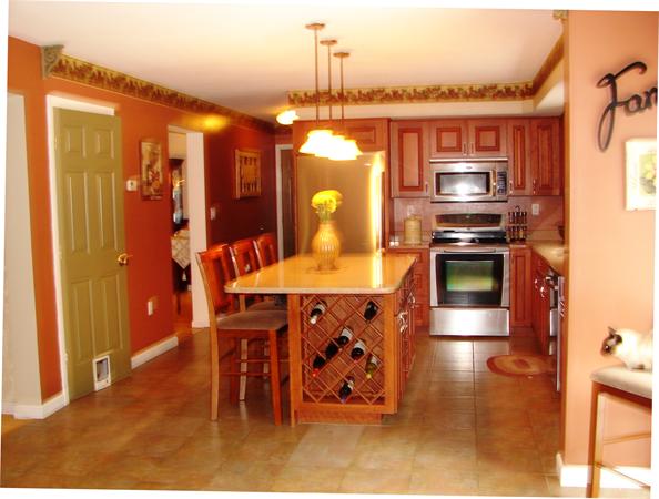 108 Fitch Road Lancaster, MA 01523 - Photo 3 of 20 a kitchen with stainless steel appliances granite countertop a sink a stove and a refrigerator