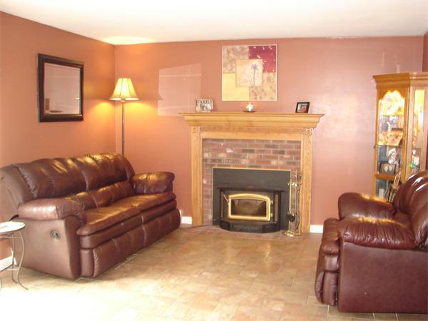 108 Fitch Road Lancaster, MA 01523 - Photo 5 of 20 a living room with furniture and a fireplace