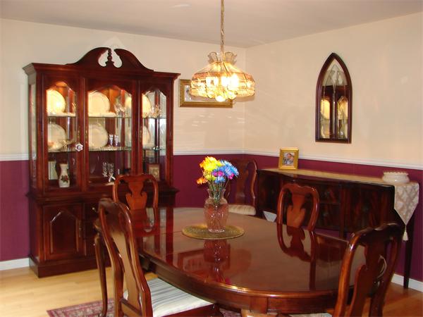 108 Fitch Road Lancaster, MA 01523 - Photo 7 of 20 a view of a dining room with furniture and chandelier