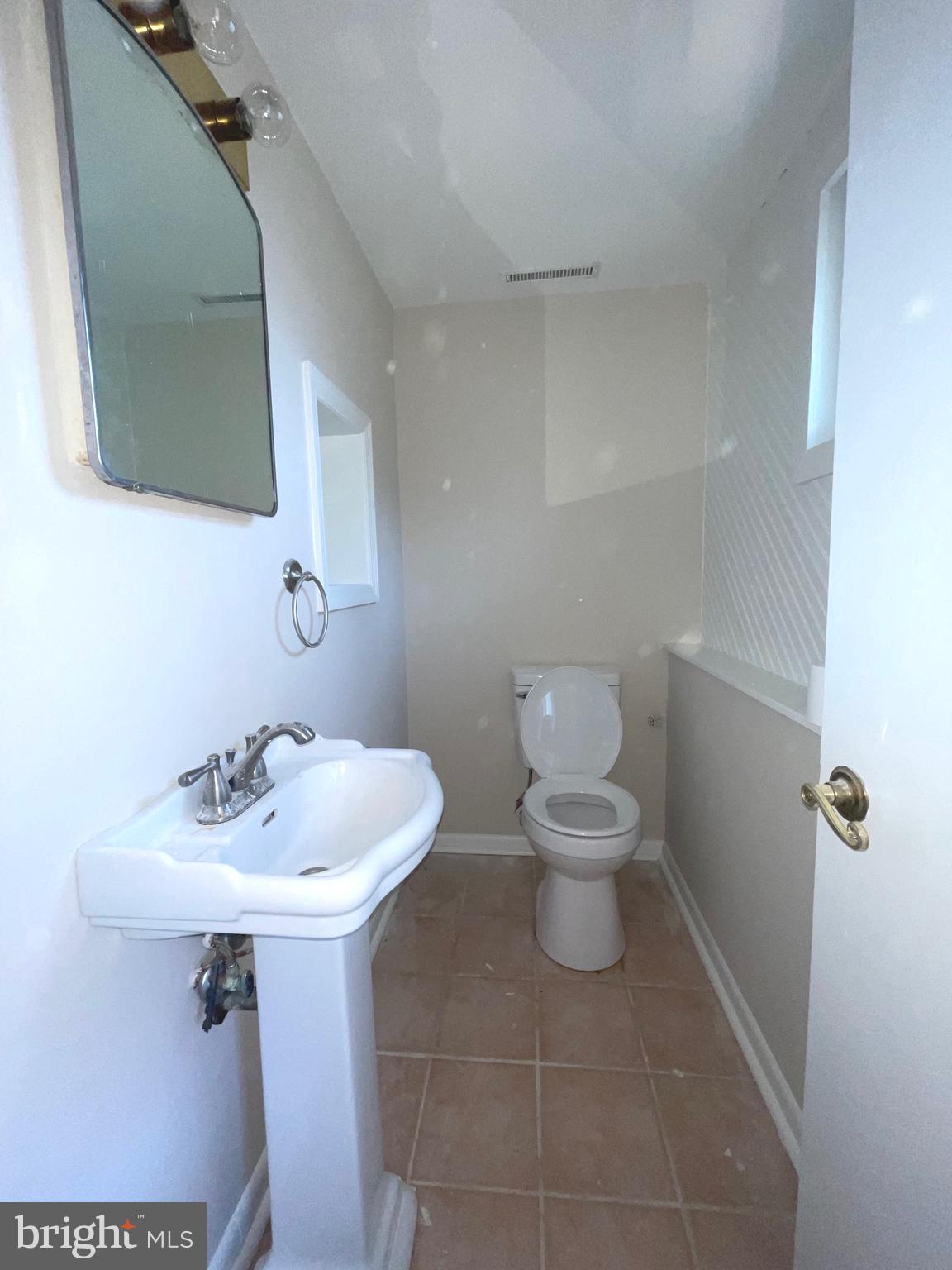 292 Justice Drive Carneys Point, NJ 08069 - Photo 12 of 17 a bathroom with a toilet sink and mirror