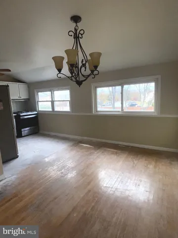 a view of empty room with windows