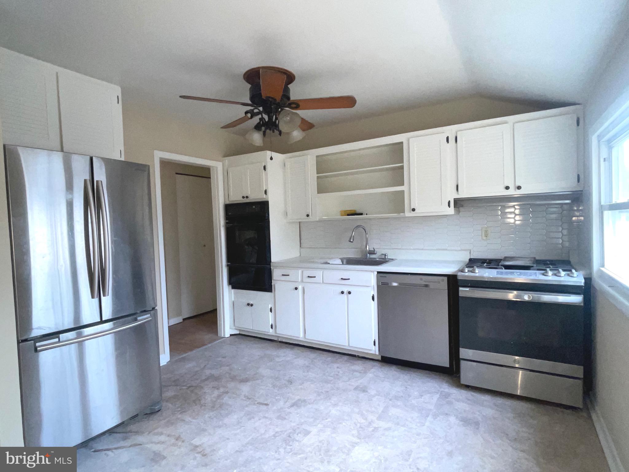 292 Justice Drive Carneys Point, NJ 08069 - Photo 6 of 17 a kitchen with stainless steel appliances a refrigerator sink and cabinets