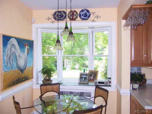 7200 River Road Richmond, VA 23229 - Photo 8 of 10 a dining room with furniture a rug and a window