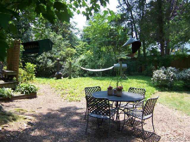 7200 River Road Richmond, VA 23229 - Photo 10 of 10 a table and chairs in a garden