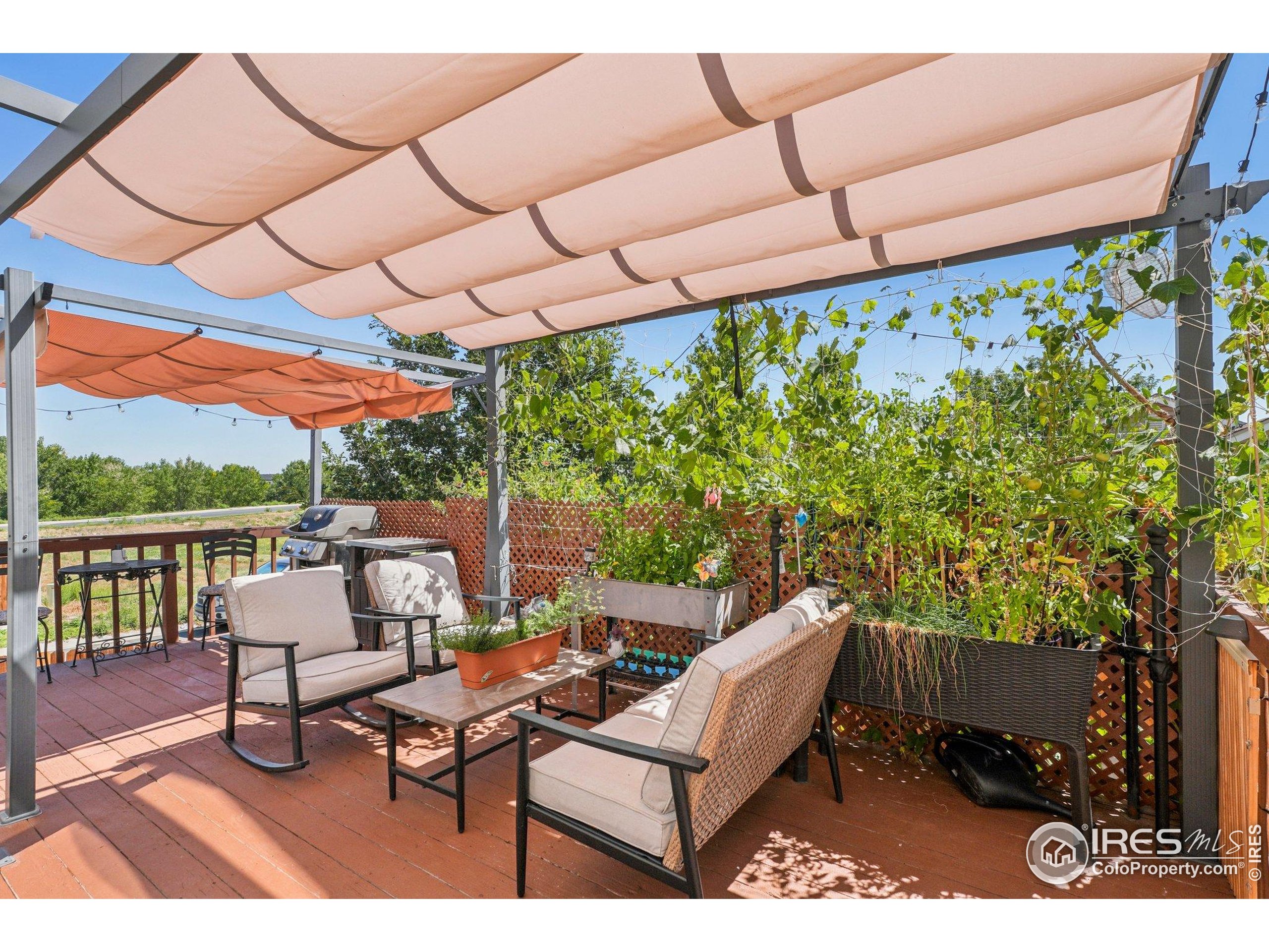 256 Homestead Way Brighton, CO 80601 - Photo 35 of 42 a outdoor living space with furniture and city view