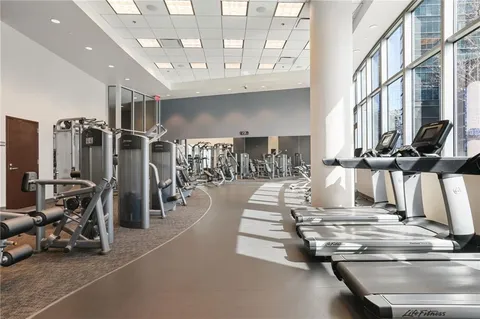 a gym with lots of gym equipment