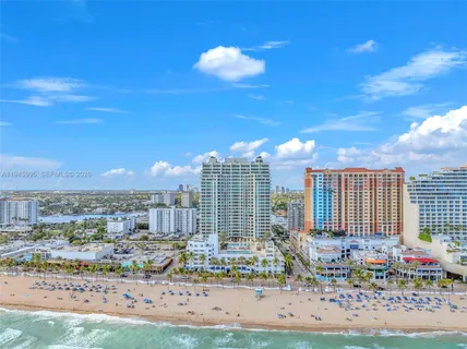a view of a swimming pool with a lounge chairs