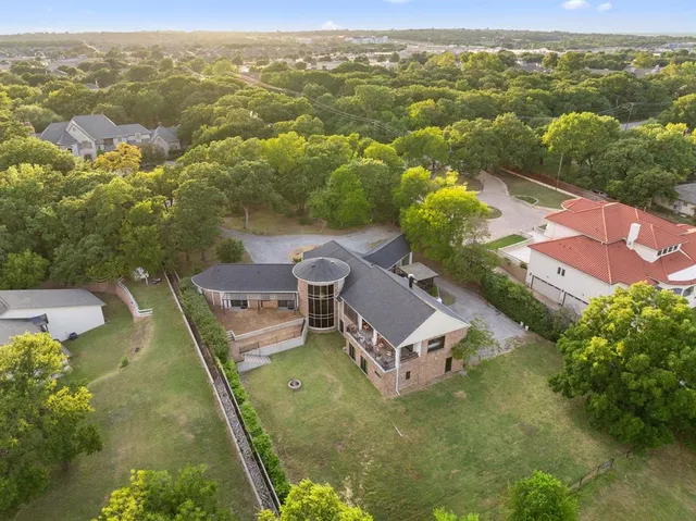 an aerial view of residential houses with outdoor space