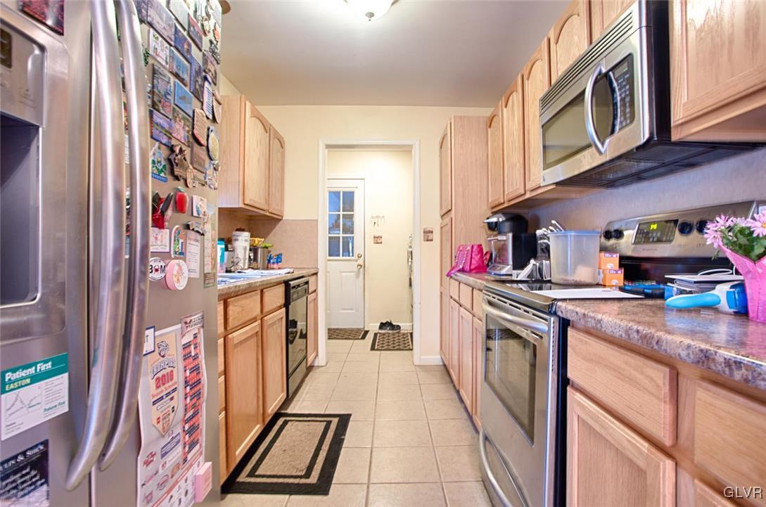 561 Clearfield Road Nazareth, PA 18064 - Photo 5 of 23 a kitchen with stainless steel appliances granite countertop a stove and cabinets
