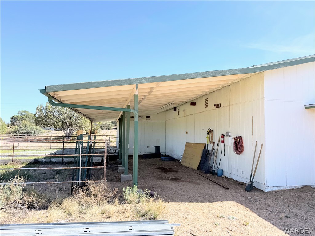 1575 South Roy Road Kingman, AZ 86401 - Photo 23 of 56 The property features a covered outdoor area with a metal roof and support columns