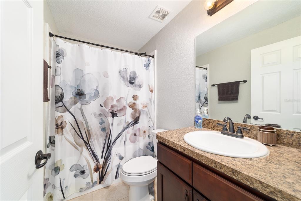 38 Cedar Tree Terrace Ocala, FL 34472 - Photo 11 of 18 a bathroom with a granite countertop sink and a mirror