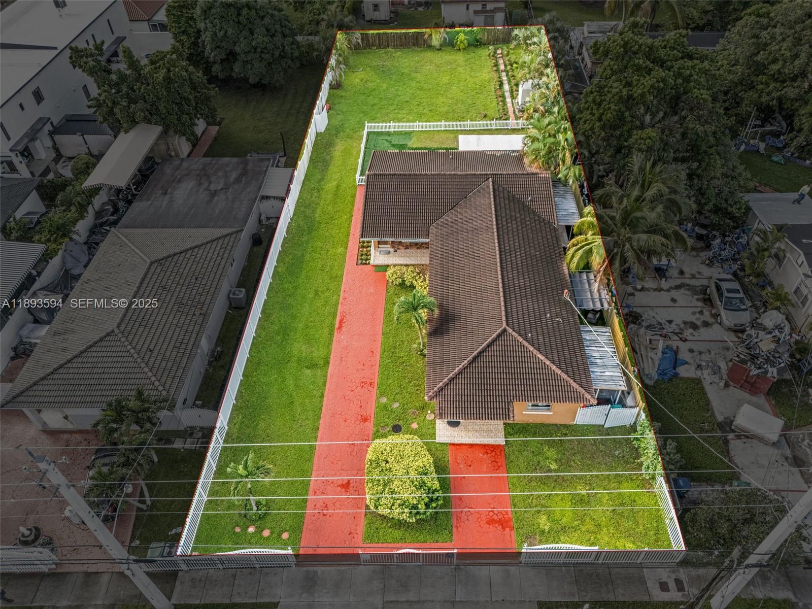 an aerial view of a tennis ground with large trees