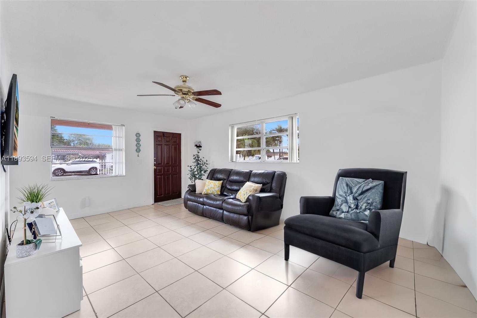 8820 Southwest 27th Street Miami, FL 33165 - Photo 23 of 36 a living room with furniture and a ceiling fan