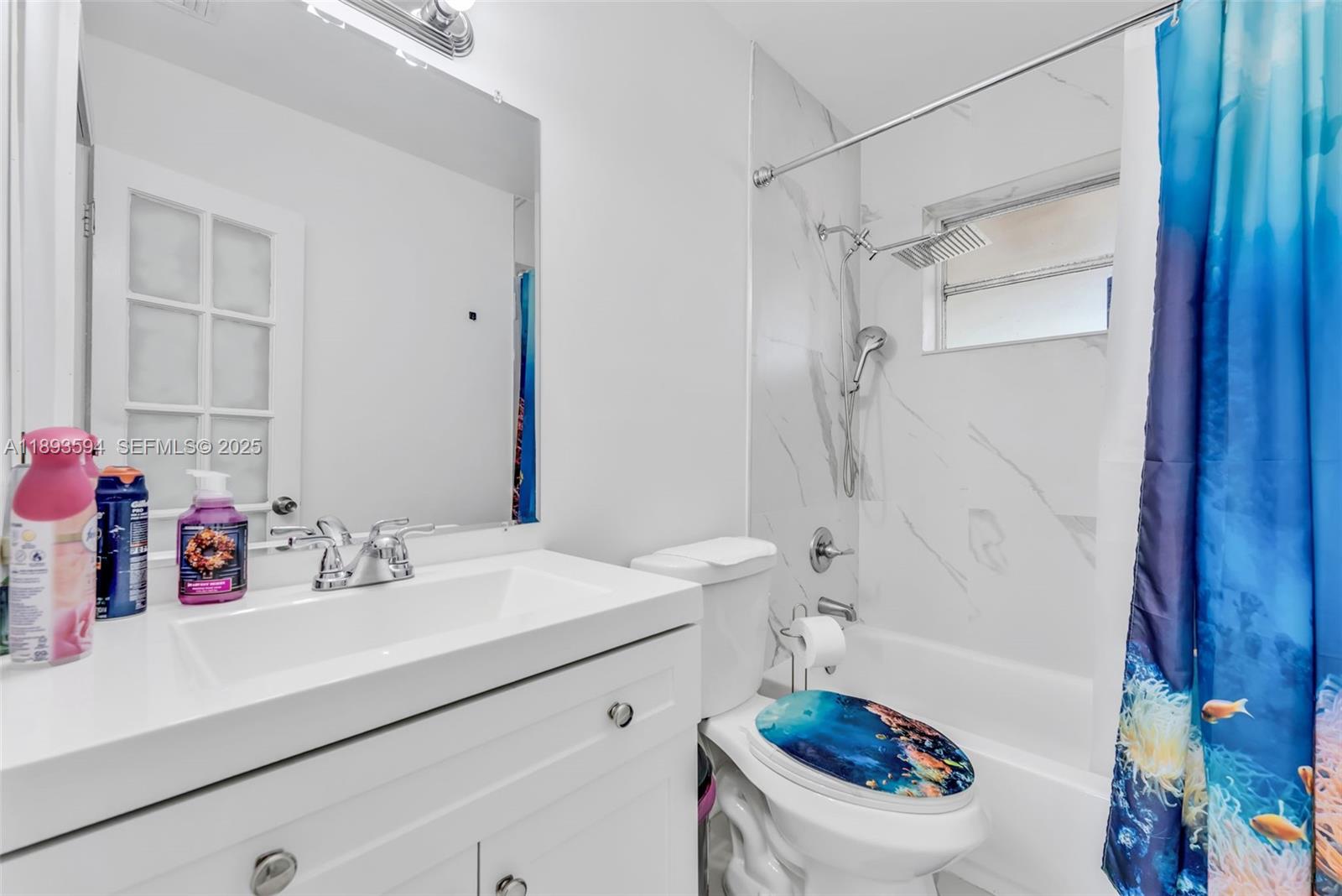 8820 Southwest 27th Street Miami, FL 33165 - Photo 28 of 36 a bathroom with a sink a toilet and shower