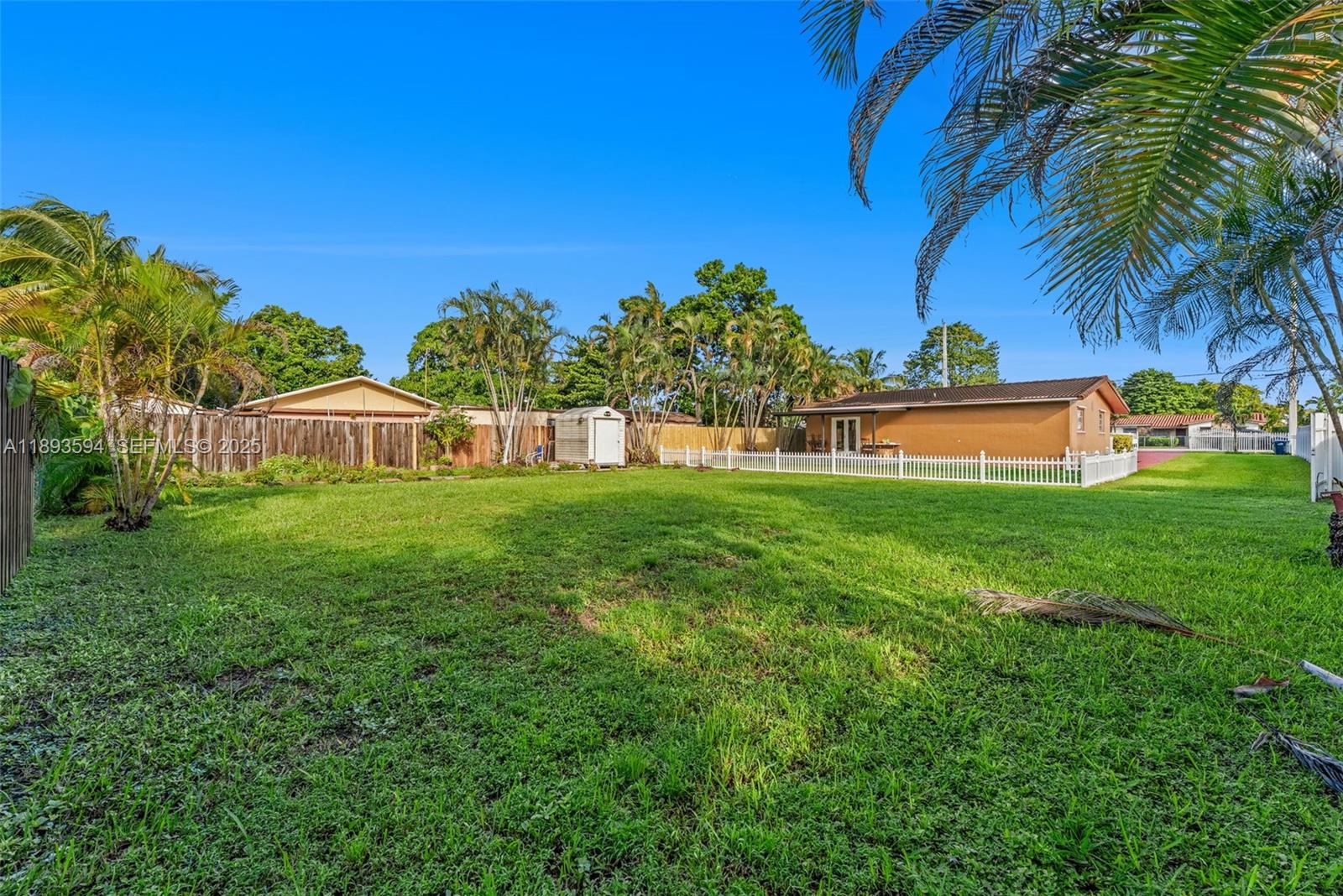 8820 Southwest 27th Street Miami, FL 33165 - Photo 32 of 36 a house view with a garden space