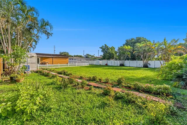 a view of yard with swimming pool and outdoor seating