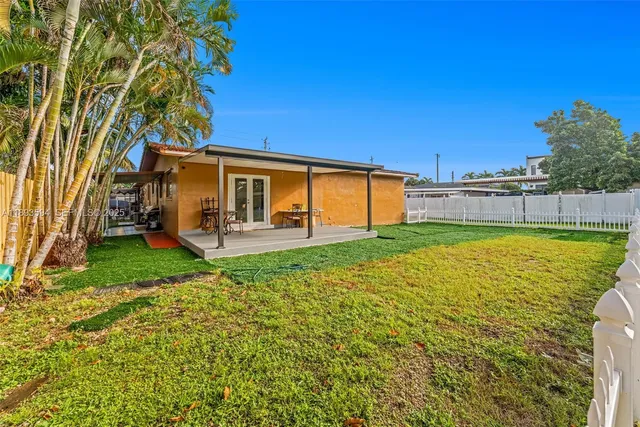 a view of a backyard with a garden and plants