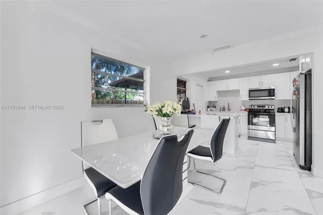 a view of a dining room with furniture
