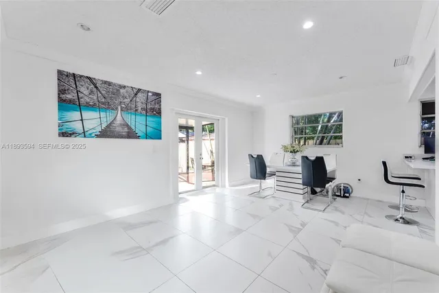 a view of a livingroom with furniture and windows