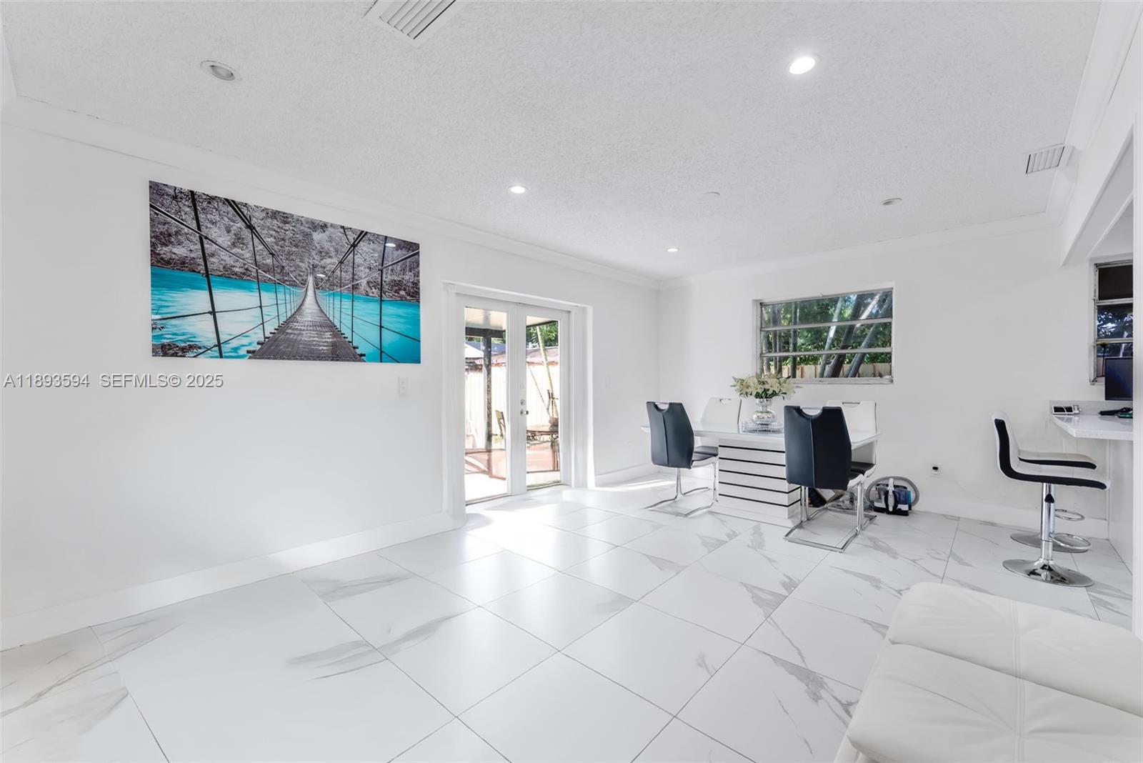 8820 Southwest 27th Street Miami, FL 33165 - Photo 9 of 36 a view of a livingroom with furniture and windows