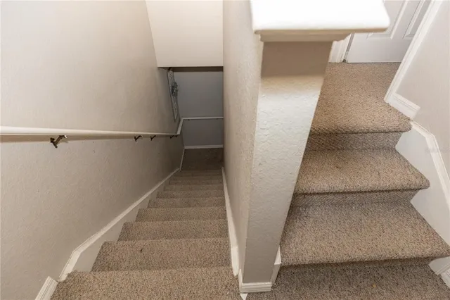 a bedroom with a bed and ceiling fan