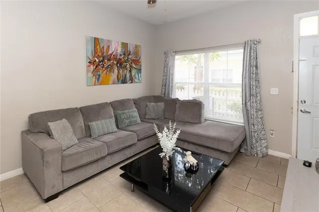 a living room with furniture and a large window