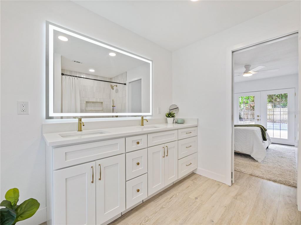 2466 Fieldingwood Road Maitland, FL 32751 - Photo 12 of 29 a spacious bathroom with 2 sink and a mirror