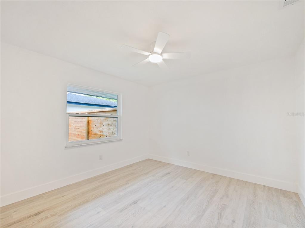 2466 Fieldingwood Road Maitland, FL 32751 - Photo 16 of 29 an empty room with a window and a fan