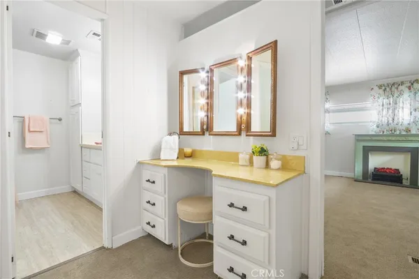 a spacious bathroom with a granite countertop sink mirror and a