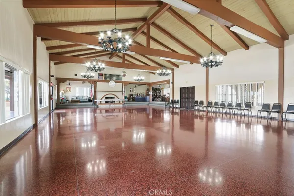 a view of a room with lots of dining room and wooden floor