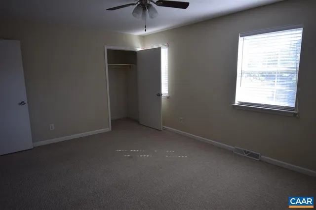 an empty room with a empty space and a window