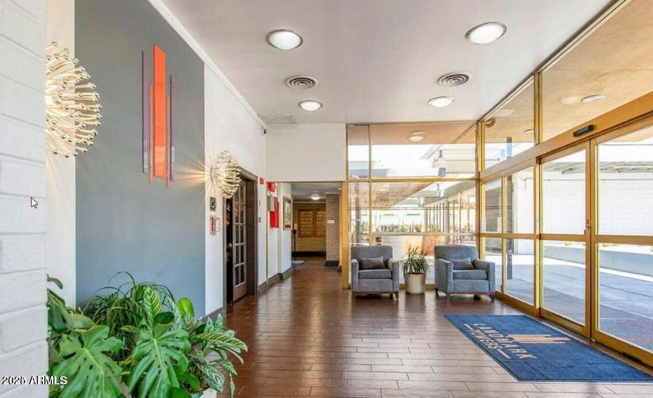 4750 North Central Avenue, Unit L8 Phoenix, AZ 85012 - Photo 26 of 55 a lobby with furniture and a potted plant