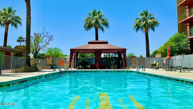 a view of a swimming pool with a terrace
