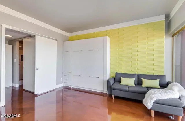 a bedroom with a bed and dresser