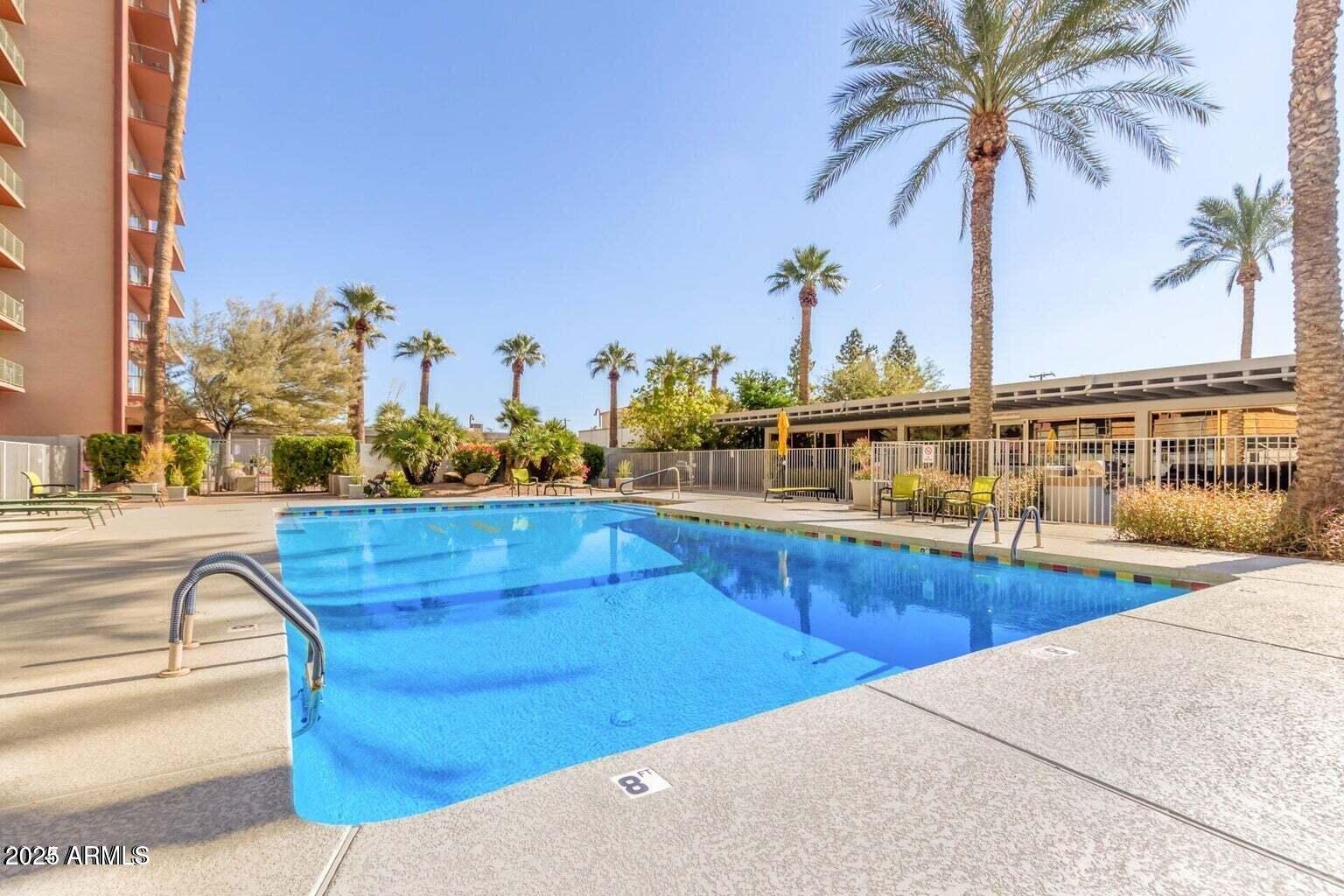 4750 North Central Avenue, Unit L8 Phoenix, AZ 85012 - Photo 44 of 55 a view of a swimming pool with a terrace