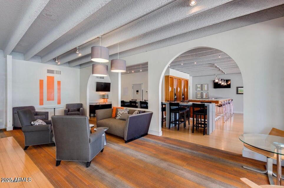 4750 North Central Avenue, Unit L8 Phoenix, AZ 85012 - Photo 45 of 55 a living room with furniture a dining table and a large window