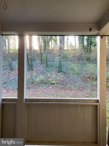a view of a room that has a large window