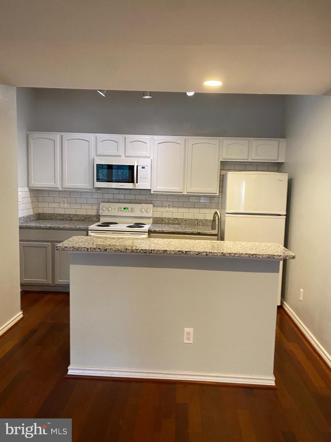 12161 Penderview Terrace, Unit 906 Fairfax, VA 22033 - Photo 2 of 20 a view of kitchen with stainless steel appliances wooden floor