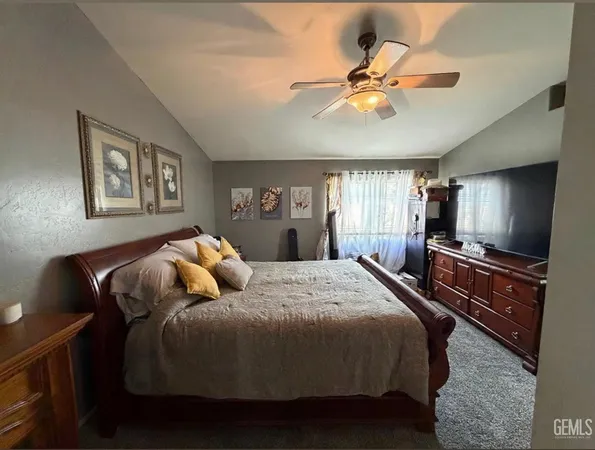 a kitchen with a refrigerator and cabinets