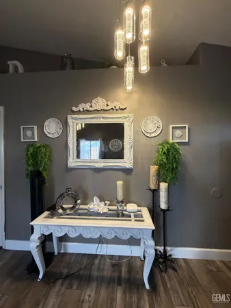 a room with a table chairs and wooden floor