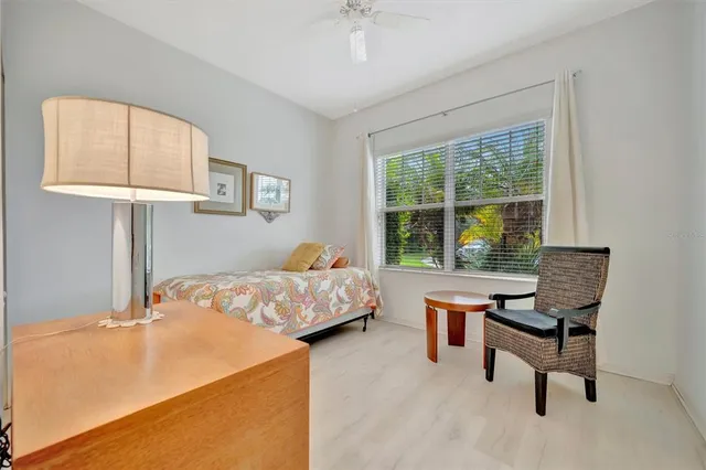 a kitchen with cabinets appliances and a dining table